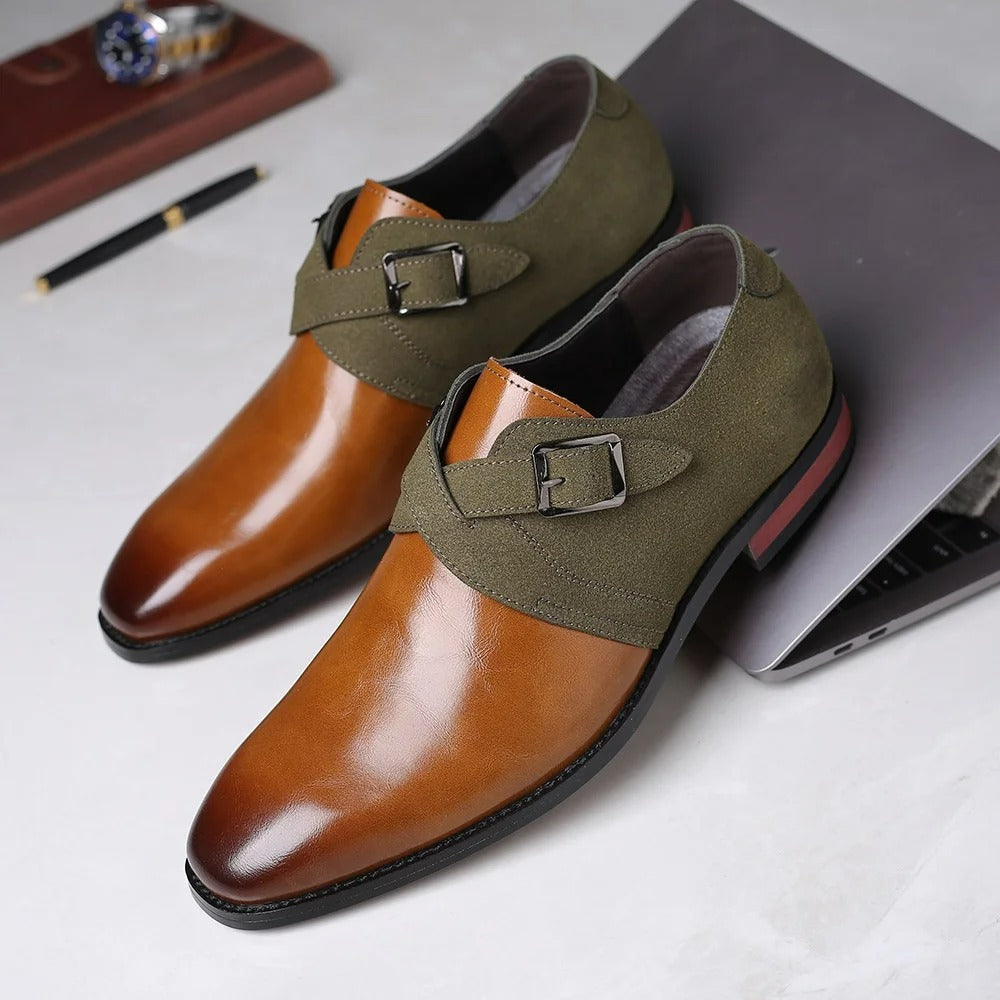 Men's tan leather and olive green suede double monk strap loafers with silver buckles on white surface