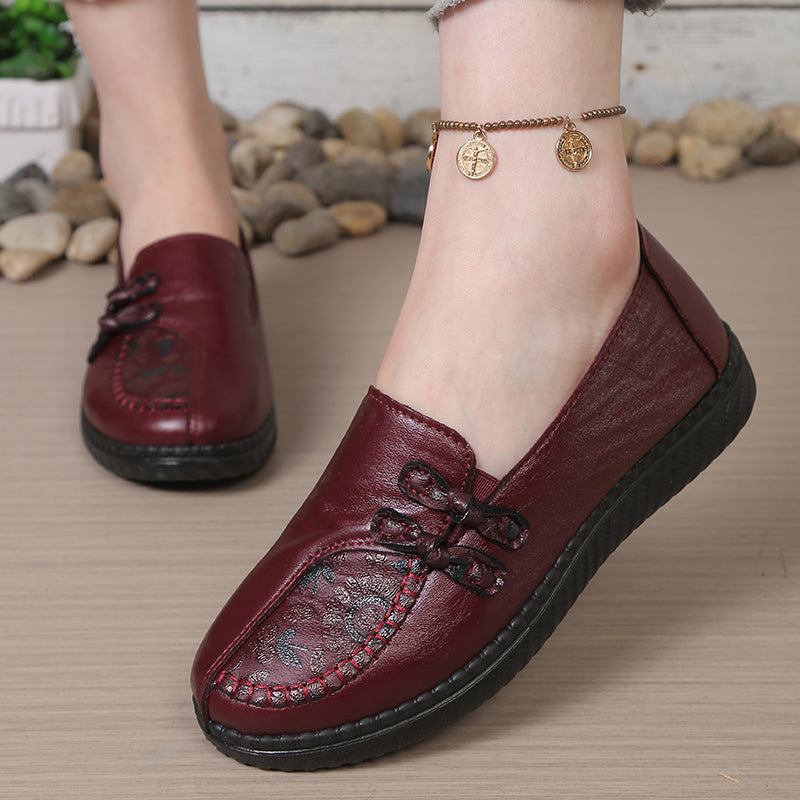 Burgundy leather slip-on loafers with decorative stitching and black sole for women, comfortable casual flats