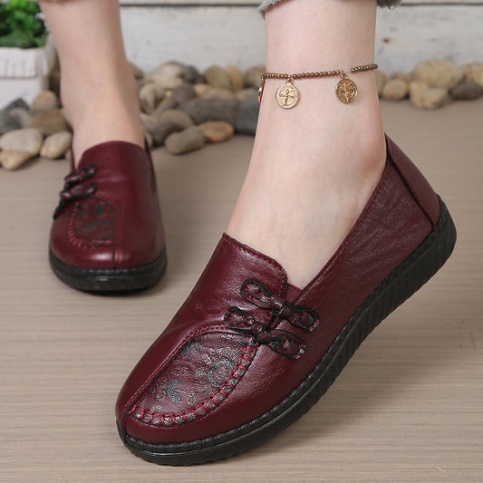 Burgundy leather slip-on loafers with decorative stitching and black sole for women, comfortable casual flats