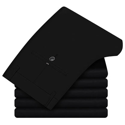 Stack of black slim fit cotton blend dress pants for men, folded and neatly arranged, showing back pocket detail