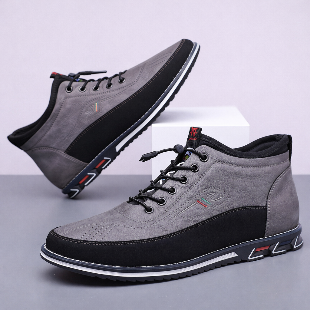 Gray men's Torven leather mid-top sneakers with black laces, contrast sole, and colorful accent details, shown as a pair.
