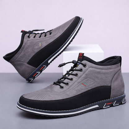 Gray men's Torven leather mid-top sneakers with black laces, contrast sole, and colorful accent details, shown as a pair.
