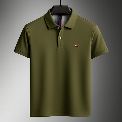 Olive green Tommy Hilfiger men's cotton polo shirt with short sleeves, button placket, and logo patch on chest.