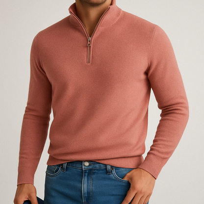 Men's coral pink cashmere blend quarter-zip sweater with ribbed collar and cuffs paired with blue jeans