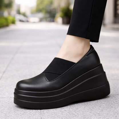 Women's black genuine leather orthopedic platform slip-on shoes with thick stacked sole and elastic band detail