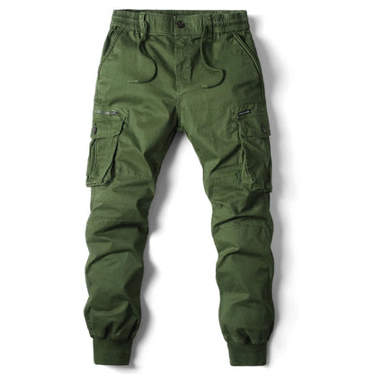 Army green slim-fit cargo jogger pants with elastic waistband, drawstring, multiple pockets, and ribbed ankles.