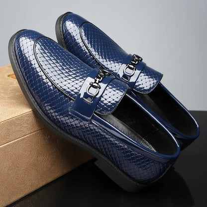 Men's navy blue woven leather loafers with silver metal buckle detail and textured pattern finish