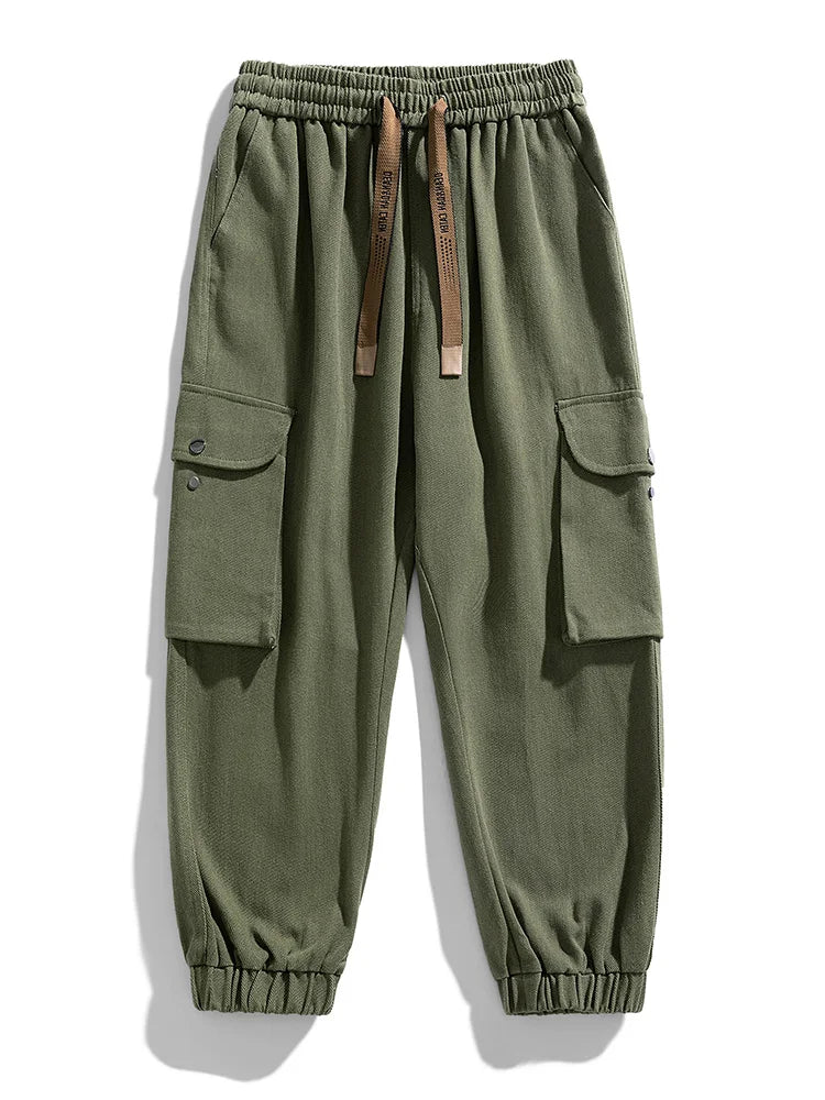 Army green men's cargo joggers with side pockets, elastic waistband, drawstring, and tapered ankles.