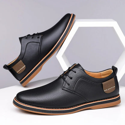 Black men's leather lace-up derby shoes with tan sole, pebbled texture, and brown heel tab accent, shown from two angles.