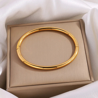 Non-tarnish gold bangle bracelet for women in gift box with white tissue paper, hinged closure design