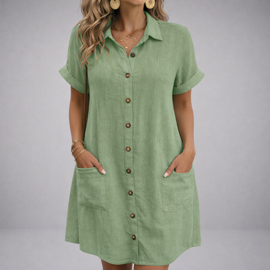 Women's sage green linen button-up shirt dress with rolled short sleeves and front pockets