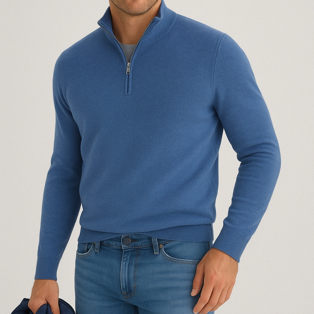Men's blue cashmere blend quarter-zip sweater with ribbed collar cuffs and hem worn with jeans