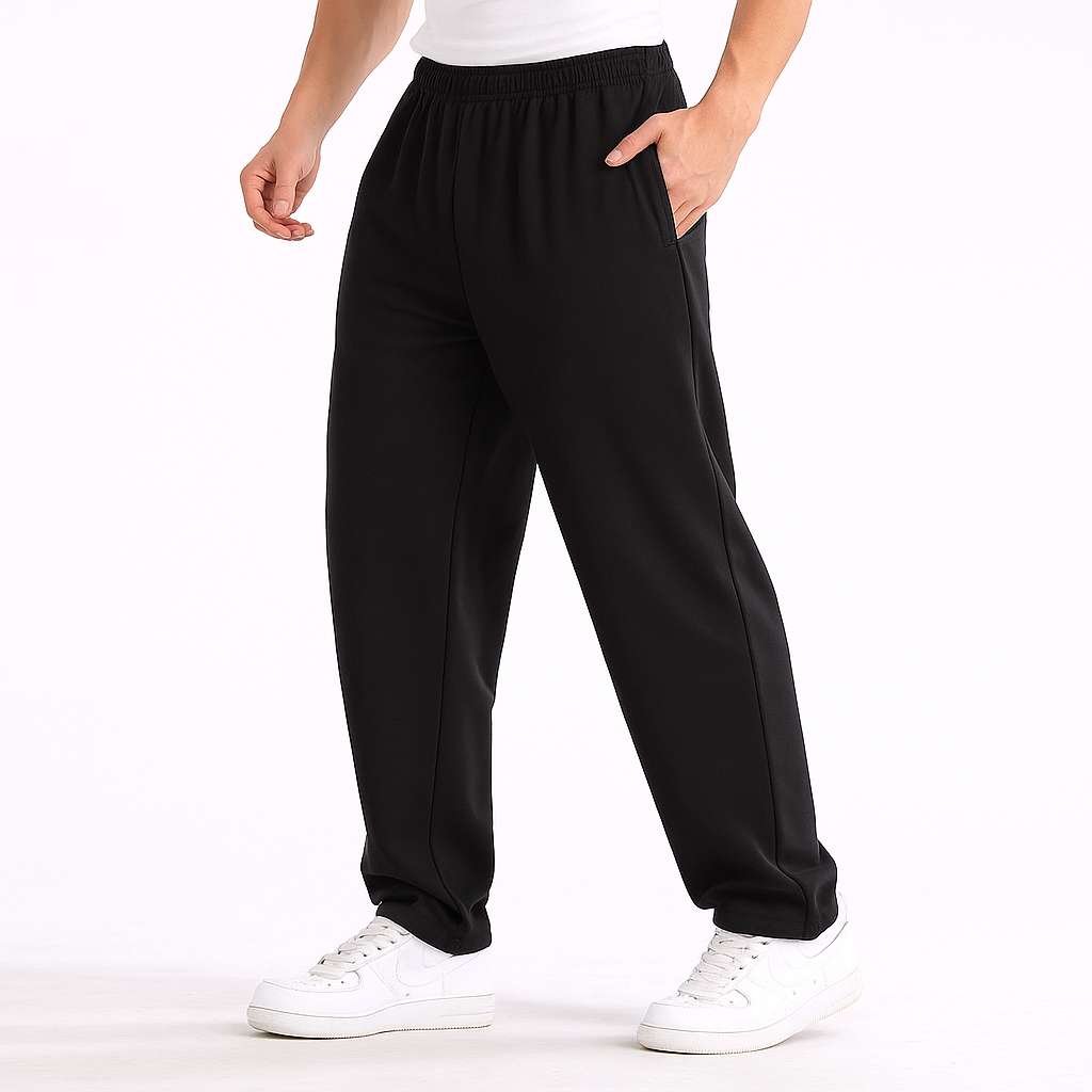 Black Vex Cotton Elastic Waist Sweatpants for Men with side pockets, worn with white sneakers, relaxed fit