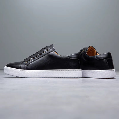 Black leather lace-up men's sneakers with white rubber sole and tan interior heel lining, side profile view