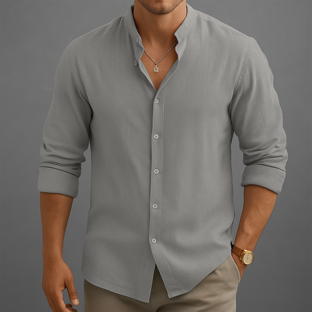 Men's gray linen band collar button-up shirt with rolled sleeves, worn with khaki pants and gold watch.
