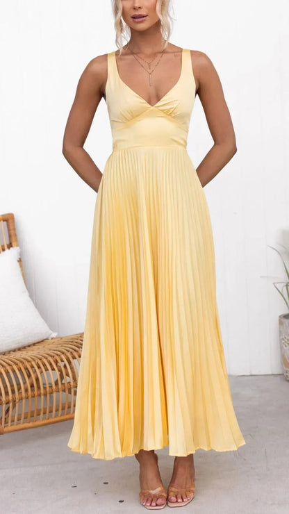 Pale yellow pleated maxi dress with v-neck sleeveless bodice and flowing ankle-length skirt for women