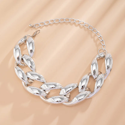 Silver chunky Cuban link chain choker necklace with lobster clasp and adjustable extender chain on beige background