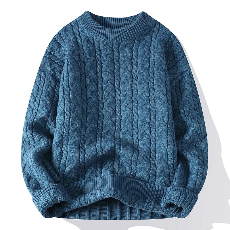 Men's blue cable knit wool blend crewneck pullover sweater with twisted pattern and ribbed cuffs and hem