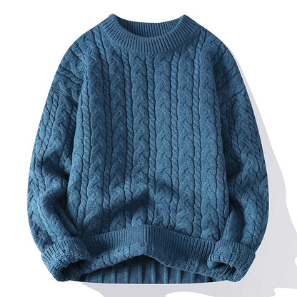 Men's blue cable knit wool blend crewneck pullover sweater with twisted pattern and ribbed cuffs and hem