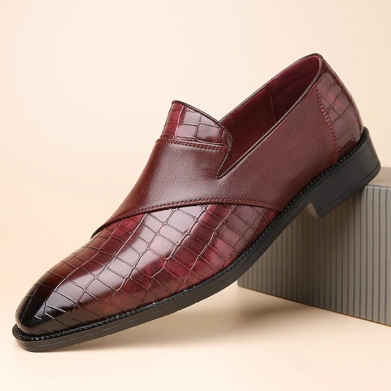 Burgundy men's leather slip-on loafers with crocodile embossed pattern and smooth toe cap detail