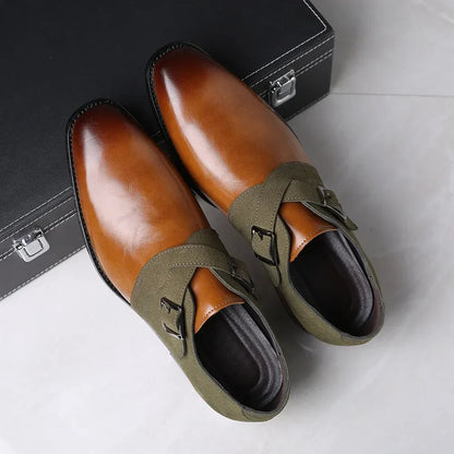 Men's brown leather loafers with olive green suede double monk strap buckles displayed with briefcase