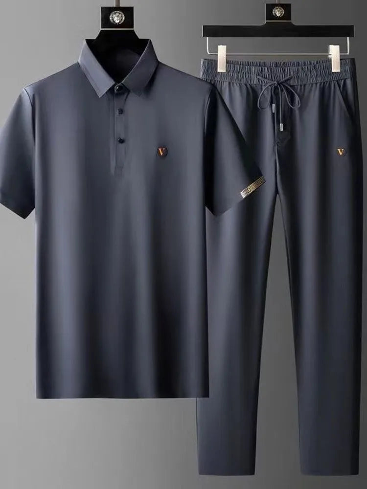 Men's navy blue Viero polo shirt and drawstring pants matching set with gold logo embroidery on hangers