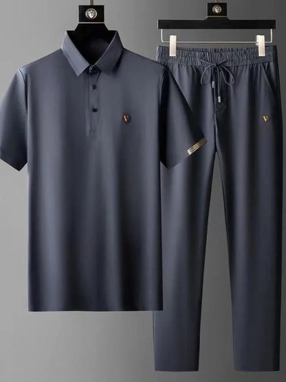 Men's navy blue Viero polo shirt and drawstring pants matching set with gold logo embroidery on hangers