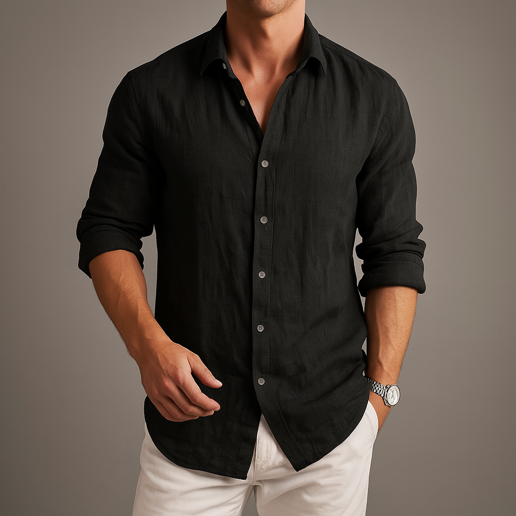 Man wearing a black linen button-up shirt with white pants and a silver watch, showcasing a relaxed yet polished fit.