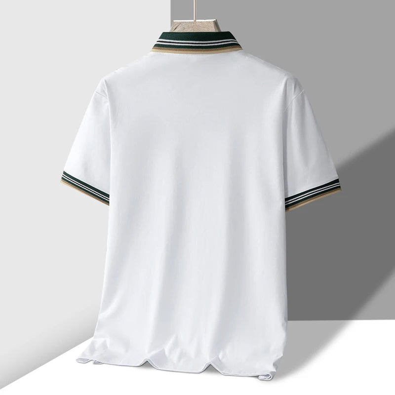 White men's polo shirt with green, white, and tan striped collar and sleeve cuffs, shown from the back on a hanger.