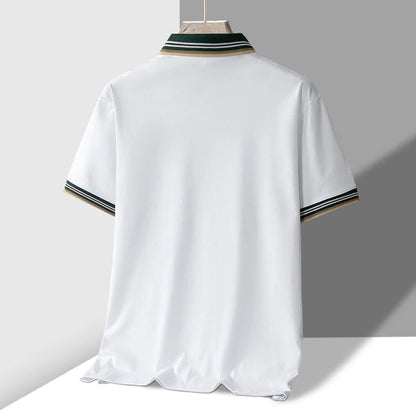 White men's polo shirt with green, white, and tan striped collar and sleeve cuffs, shown from the back on a hanger.