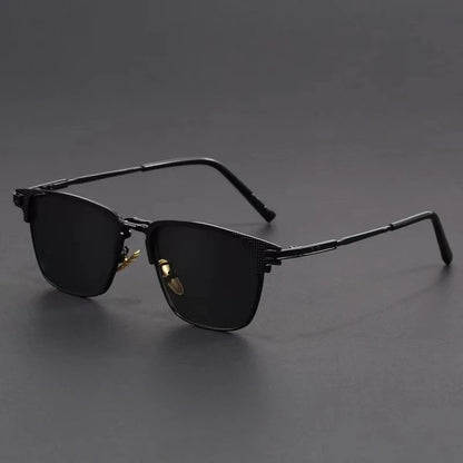 Black metal frame polarized sunglasses for men with dark lenses and sleek design on gray background