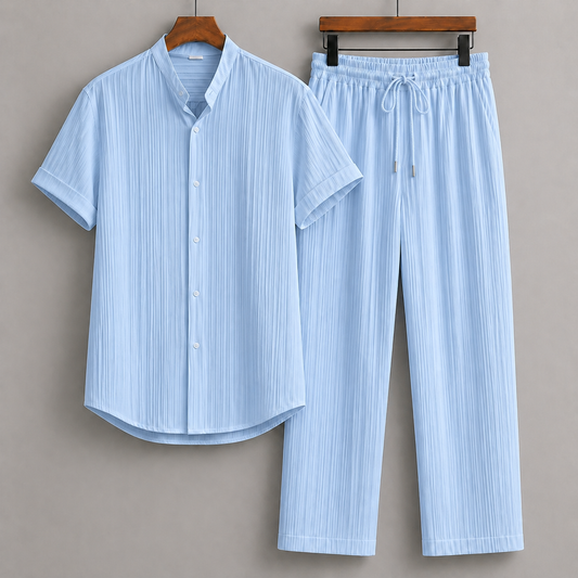 Light blue striped linen men's short-sleeve button-up shirt and drawstring pants matching set on wooden hangers