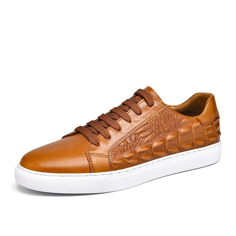 Tan leather men's sneakers with crocodile embossed side detail, lace-up closure, and white rubber sole.