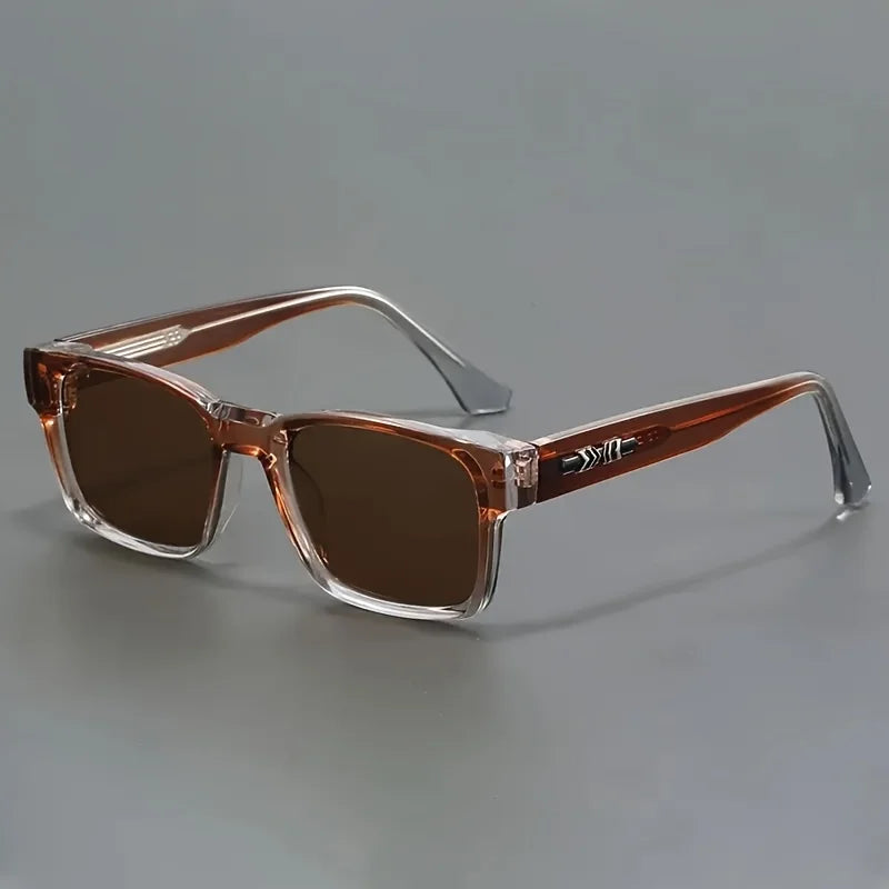 Brown rectangular frame sunglasses with dark brown lenses and clear gradient temples, displayed on gray background.