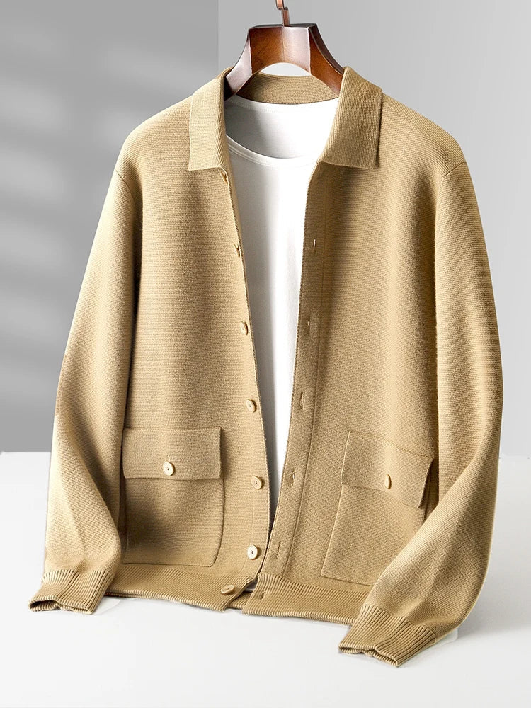 Men's beige merino wool button-up cardigan jacket with collar and front pockets on wooden hanger