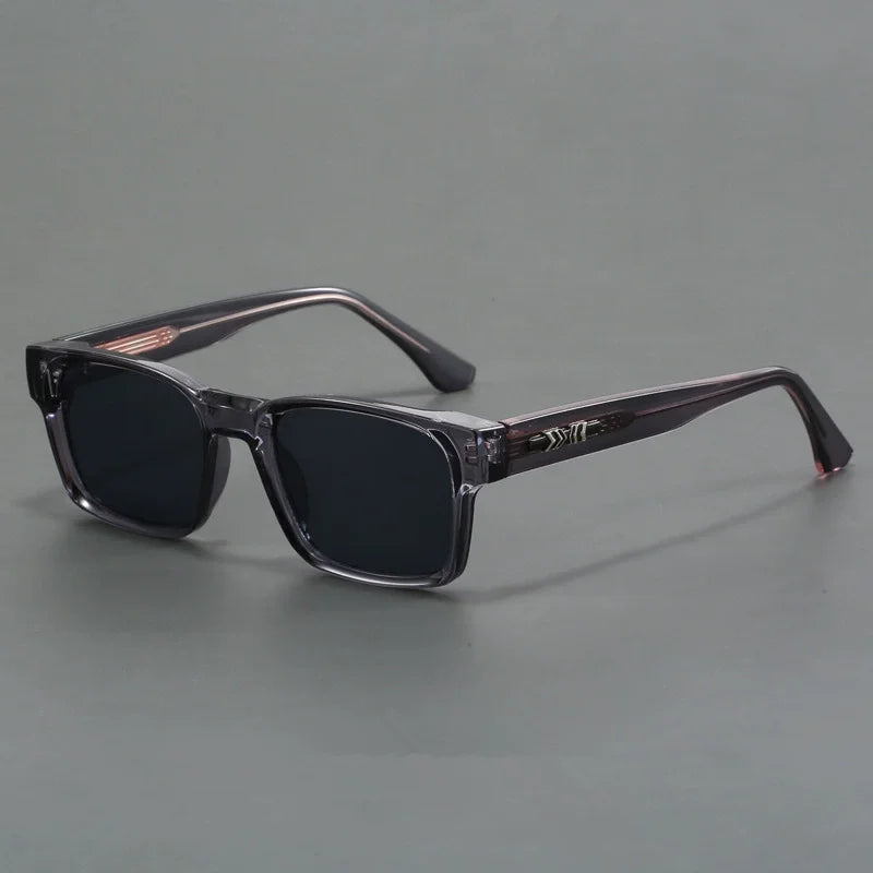 Rectangular frame sunglasses with dark lenses and translucent gray temples for men's eyewear fashion