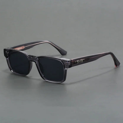 Rectangular frame sunglasses with dark lenses and translucent gray temples for men's eyewear fashion