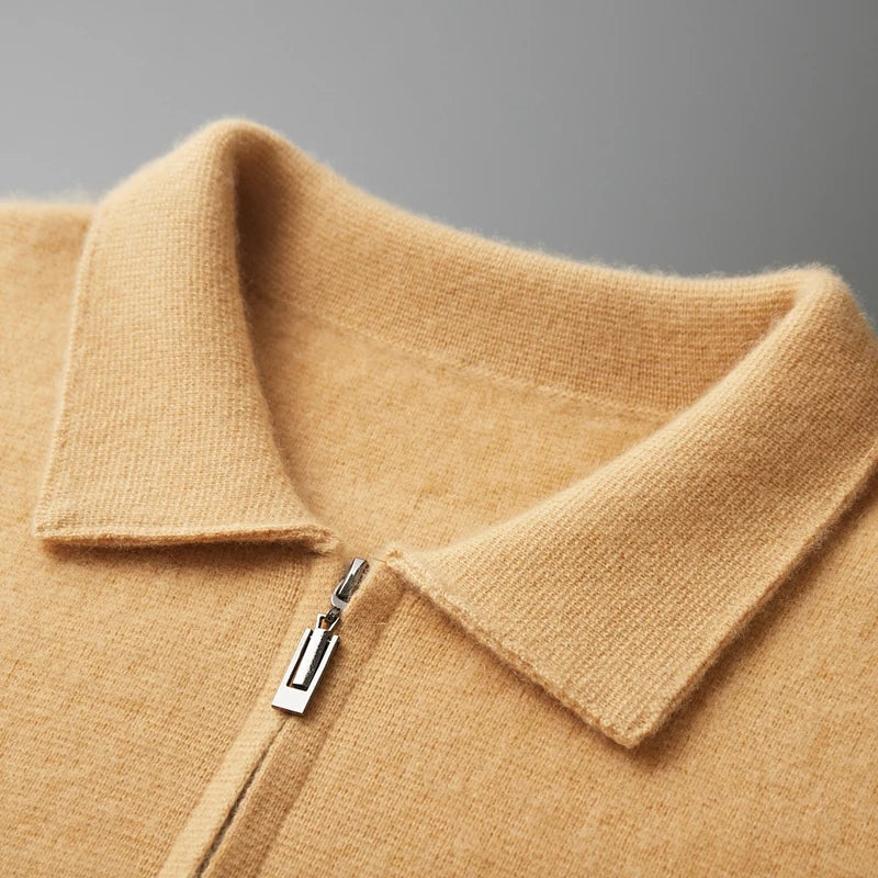 Camel-colored men's cashmere zip-up sweater jacket with spread collar and silver zipper pull, close-up detail view.