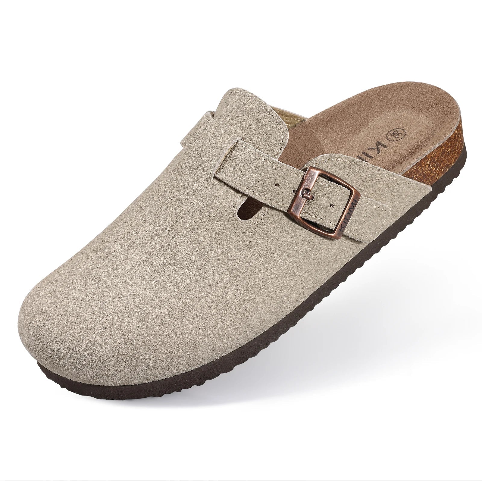 Beige suede slip-on clog mule with copper buckle strap, cork footbed, and dark brown rubber outsole.