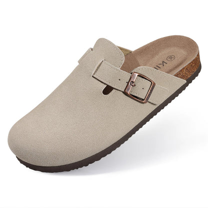 Beige suede slip-on clog mule with copper buckle strap, cork footbed, and dark brown rubber outsole.