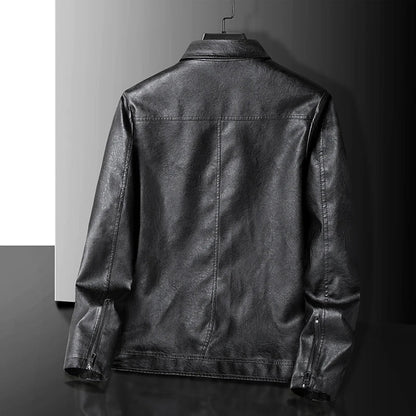 Back view of a black men's leather zip-up jacket with panel stitching and zipper cuffs, displayed on a hanger.