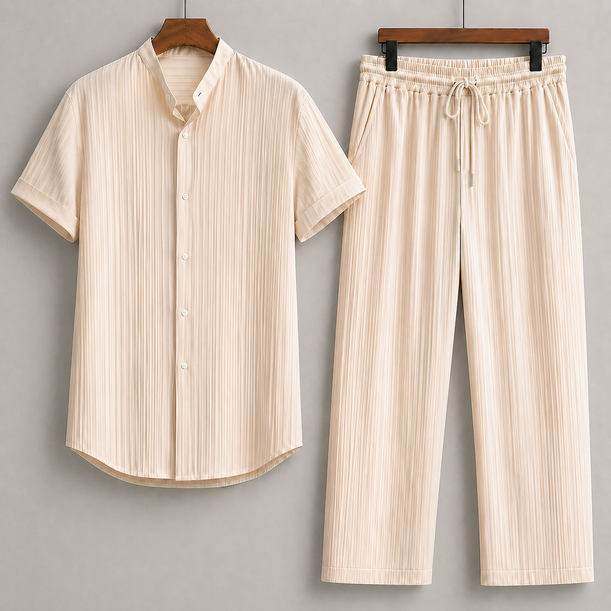 Beige textured linen men's matching set with short-sleeve button shirt and drawstring wide-leg pants on hangers