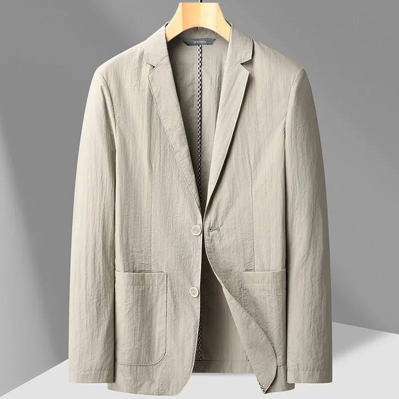 Light khaki men's two-button blazer with notch lapels, patch pockets, and textured fabric on a wooden hanger