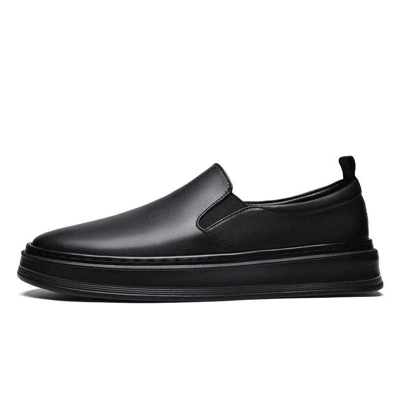 Black leather slip-on loafer sneakers for men with elastic side panels and thick flat sole, side view