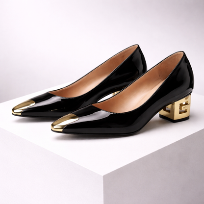 Black patent leather pumps with gold metal toe caps and geometric block heels for women