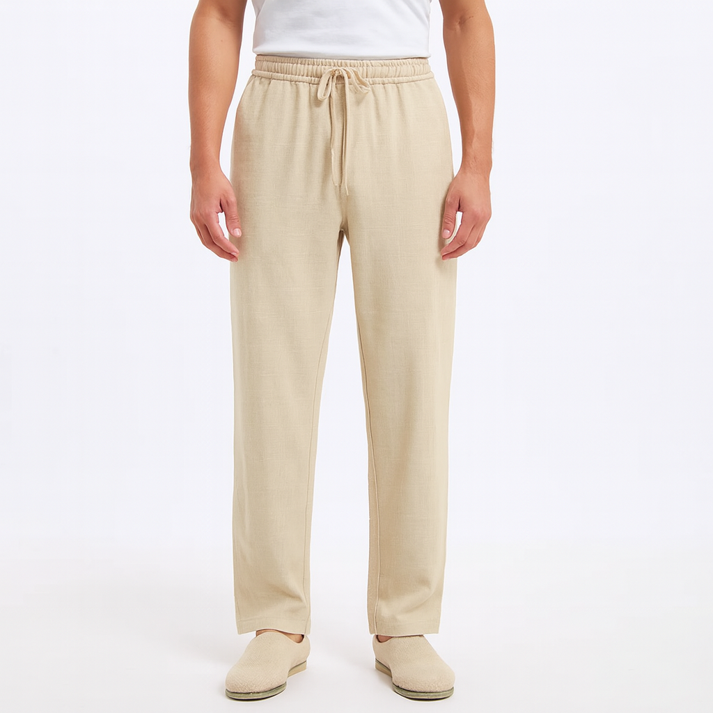 Men's beige cotton drawstring pants with elastic waist and relaxed fit on white background