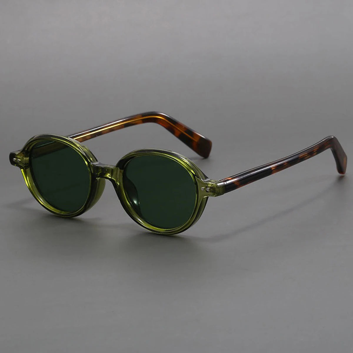 Round vintage green sunglasses with translucent olive frames and tortoiseshell brown temples for men