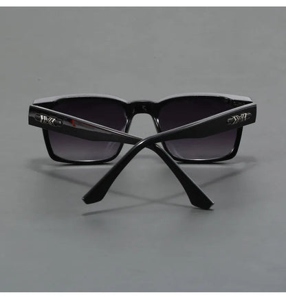 Black square frame UV400 sunglasses for men with gradient lenses and silver hardware accents, rear view