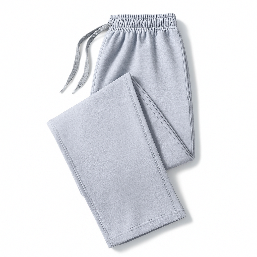 Light gray men's cotton joggers folded flat, featuring elastic drawstring waistband and side pockets.