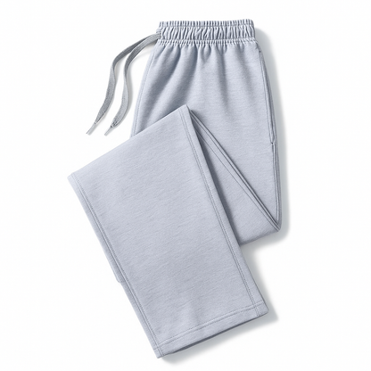 Light gray men's cotton joggers folded flat, featuring elastic drawstring waistband and side pockets.